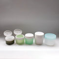 Sleek Cylindrical Empty Cosmetic Cream Jar with Hinged Spatula in Lid Chamber for Clay Face Mask